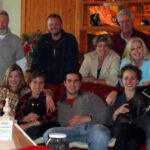 Dobson family with friends indoors cropped