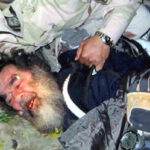 former Iraqi leader Saddam Hussein moments after his capture by US forces in a farm house outside Tikrit