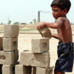 boy stacking bricks