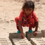 girl in brick factory