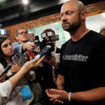 Bo Copley speaks to the media after a campaign event for U.S. Democratic presidential candidate Hillary Clinton in Williamson