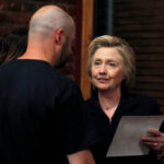 Clinton-with-Bo-holding-back